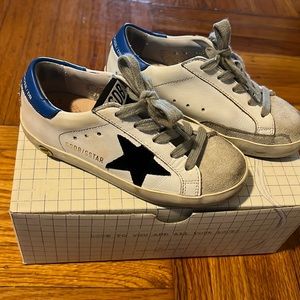 Gently used Golden Goose kids sneaker.  White/blue leather and suede.
